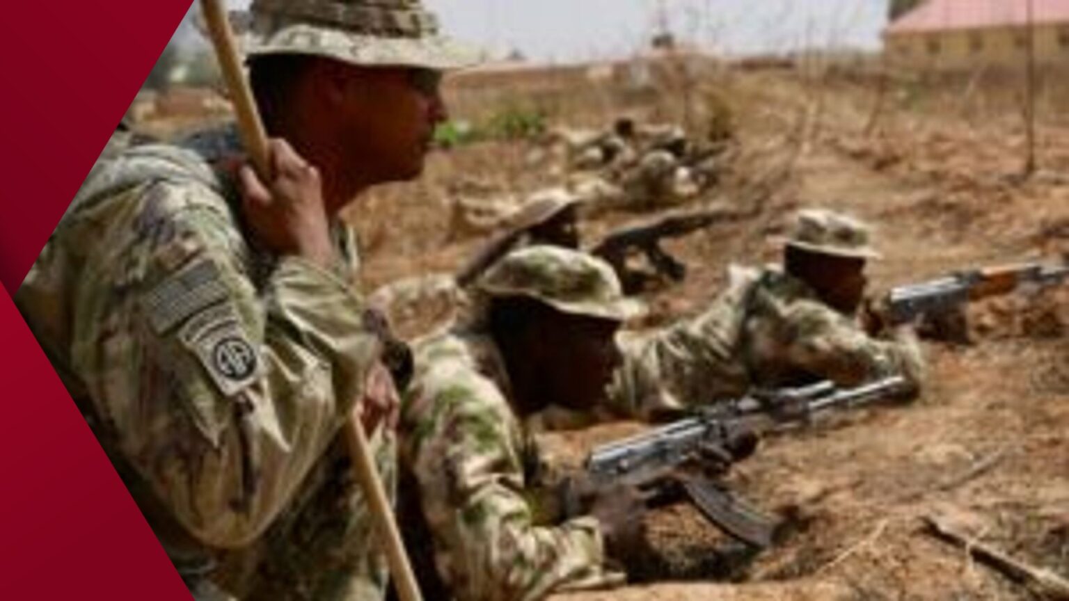 American soldiers in tactical gear demonstrate rifle handling to West African troops on a dusty training ground