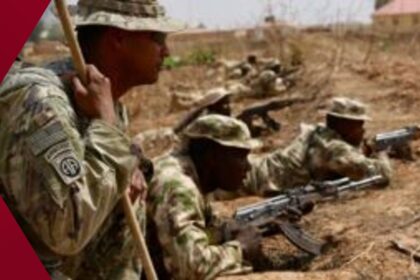 American soldiers in tactical gear demonstrate rifle handling to West African troops on a dusty training ground