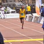 38-year-old Hamadou Bi Ibrahim holding his trophy and certificate after winning first prize in the senior men’s category.